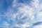 Beautiful epic blue sky with white and grey cirrus clouds background texture