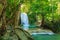 Beautiful Erawan waterfall with sunlight in the morning