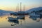 Beautiful evening Mediterranean landscape with boats on water. Montenegro, view of Bay of Kotor