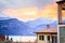 Beautiful evening scenery in the holidays: Apartment house, mountains and colourful sky