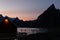 Beautiful evening sky over the mountains of Lofoten, Norway with a fishermen\\\'s hut and a fishing rack in front
