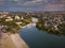 Beautiful evening top view of the river, city, central beach, churches, bridge. Bila Tserkva