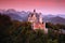 Beautiful evening view of the Neuschwanstein castle, with autumn colours after sunset, Bavarian Alps, Bavaria, Germany