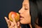 Beautiful exotic woman with apple