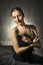 Beautiful expressive ballerina in the role of a black swan