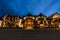 Beautiful exterior of a hotel illuminated with lights against the sky during nighttime in Banff