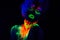 Beautiful extraterrestrial model woman with blue hair and green lips in neon light. It is portrait of beautiful model
