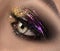 Beautiful eye makeup with colorful sparks. Beauty bright fashion holiday smoky eyes makeup