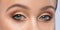 Beautiful eyes of a woman with bright make-up close-up.  makeup and healthy clean skin. Professional makeup concept