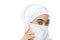 beautiful eyes of woman with white veil with nose and mouth covered by a piece of cloth