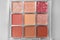 Beautiful eyeshadow palette on light gray background, top view. Professional cosmetic product