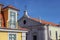 The beautiful facade of a house and a church