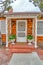 Beautiful facade of house with steps portico and storm door at the entrance