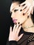 Beautiful face of fashion woman with black nails and bright make