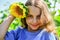 Beautiful face little girl playing sunflowers nature background, beauty concept