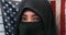 Beautiful face of Muslim woman in traditional Islam burqa or burka head scarf posing cheerful and happy smiling isolated on United