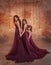 A beautiful family outfit. Mom and two daughters stand in luxurious purple-burgundy dresses with a long train against