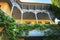 Beautiful and famous colorful Tbilisi wooden balcony with wine grape growing around