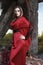 Beautiful fashion model girl wearing a red long skirt and a red