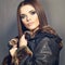 Beautiful fashion model , leather fur clothes. Young woman
