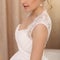 Beautiful fashion model. Sensual bride. Woman in white wedding dress. Waiting for groom