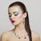 Beautiful fashion portrait of young woman with bright colorful makeup