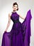 Beautiful fashion woman in purple long dress