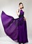 Beautiful fashion woman in purple long dress