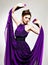 Beautiful fashion woman in purple long dress