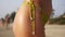 Beautiful female body in a swimsuit on the beach, closeup. Girl in a bikini on the beach