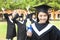 Beautiful female college graduate holding a diploma at ceremony