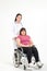 Beautiful female doctor Cure ailments of obese women patients Asians seated on a wheelchair.