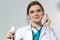 Beautiful female doctor put on stethoscope portrait