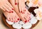 Beautiful female feet at spa salon on pedicure procedure