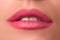 Beautiful female lips close up. Pink lipstick. Luxury makeup