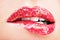 Beautiful female lips with shiny red gloss lipstick