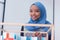 Beautiful female muslim african american architecture student looking and smiling into camera