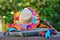 Beautiful female straw hat filled with small colored ribbons and orange lace and ribbon braid