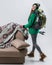 beautiful femele hiker with backpack at sofa