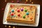 beautiful festive dessert with toppings for birthday and holidays peanut butter sheet cake