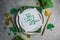 Beautiful festive table setting for St.Patricks day with cutlery and lucky symbols. Copy spase in center. Flat lay