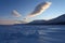 Beautiful figured clouds over blue ice formations