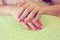 Beautiful fingernail manicure acrylic nail polish of woman