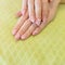 Beautiful fingernail manicure acrylic nail polish of woman