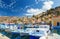 Beautiful fishing boat lined harbor at Symi, Greece