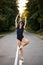 beautiful fit Caucasian woman ballet dancer on the pointy shoes and black suit dancing