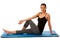 Beautiful fit hispanic woman doing stretching excercise isolated