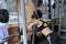 Beautiful fitnes girl is engaged in the gym doing exercise strengthens the chest