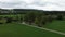 Beautiful flight on a drone, a quadrocopter above the green field and the village in Germany, Austria, Belgium.