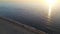 Beautiful flight in summer over the beach in Katwijk aan Zee. People are resting near the sea. Houses for tourists. Beach